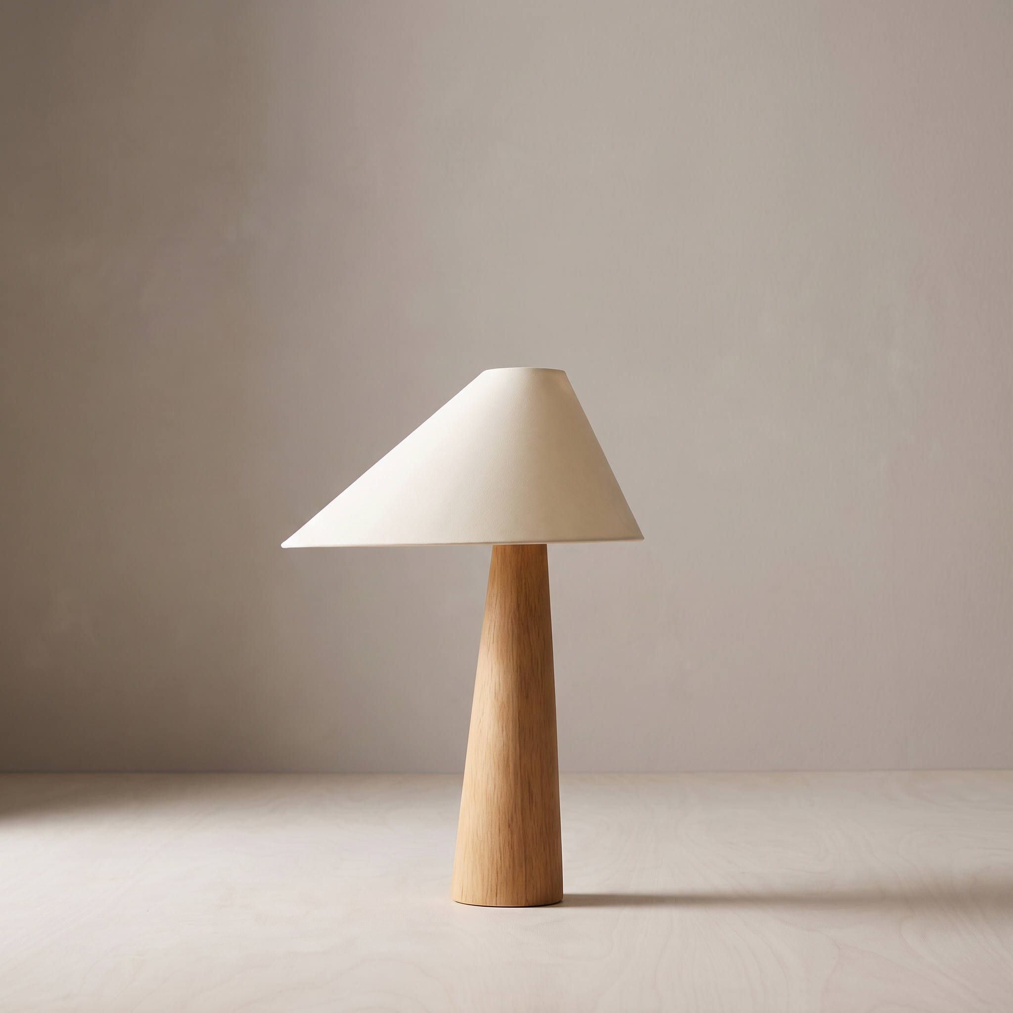 Mushi wood table lamp against a warm grey plaster wall