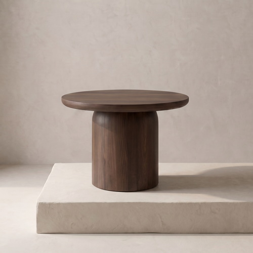 Adler dark walnut round side table on plaster plinth