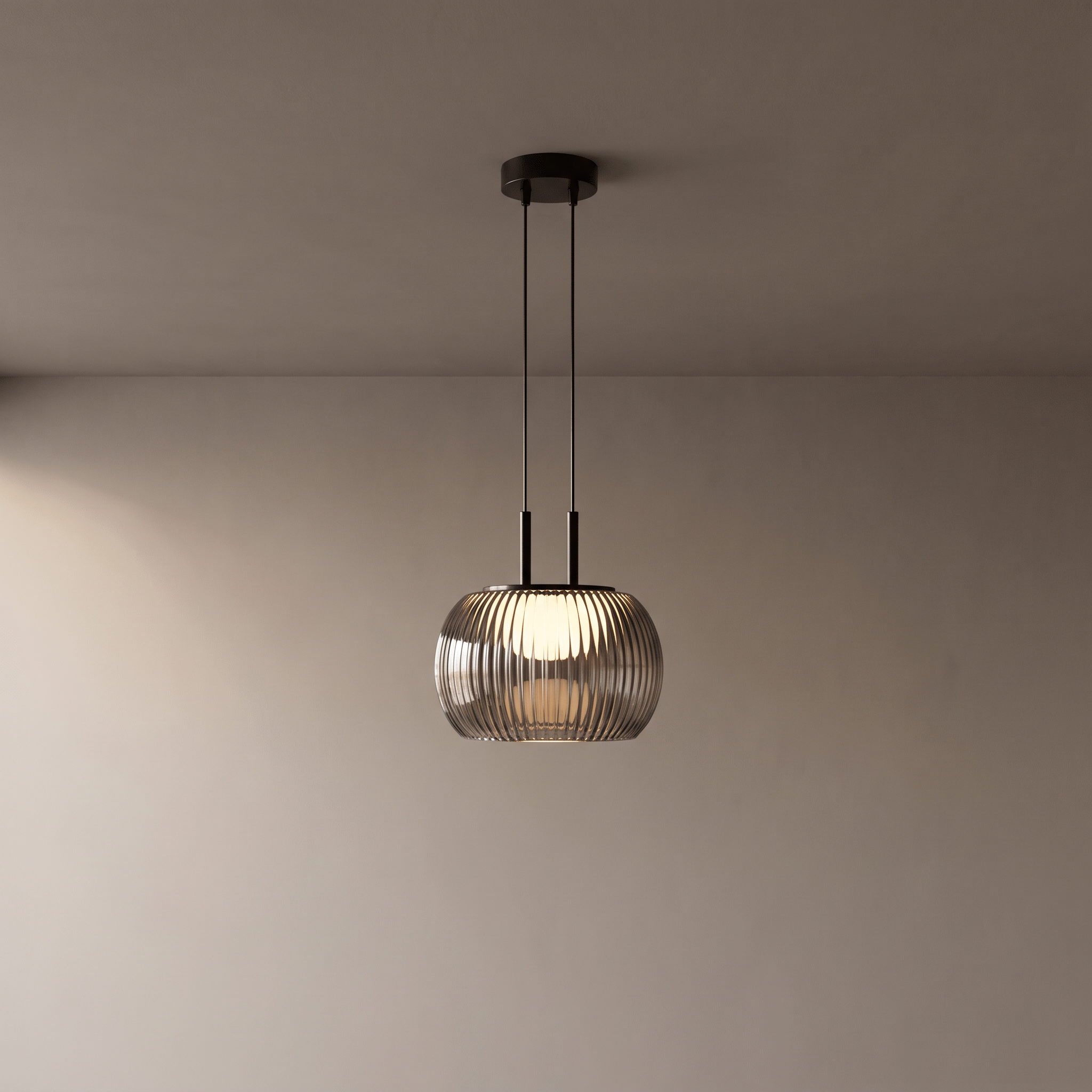 Filano pendant light hanging in front of a warm grey plaster wall