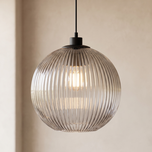 Filano pendant light lit warm against off white studio backdrop