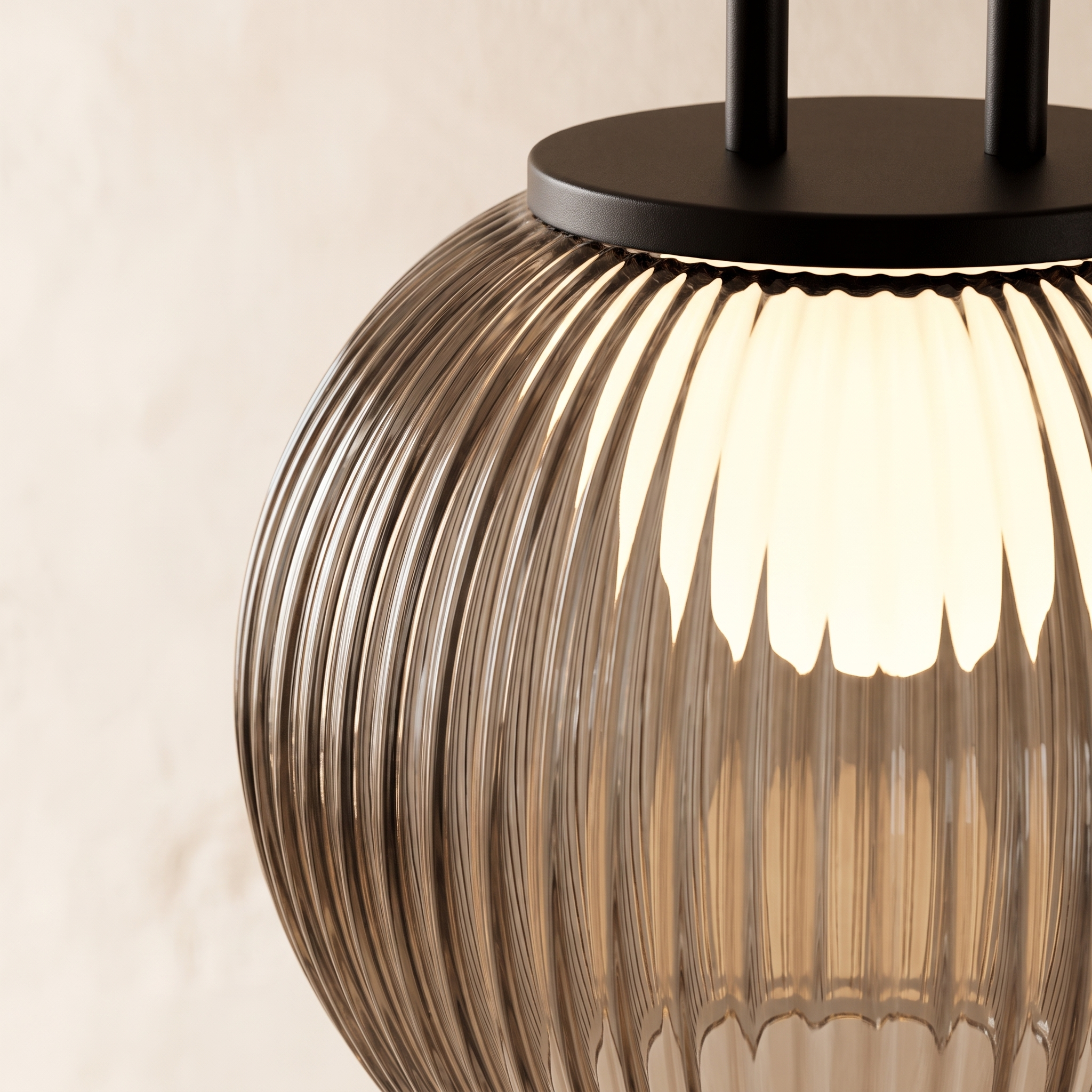 Close up of the ribbed fluted glass shade and black iron fitting
