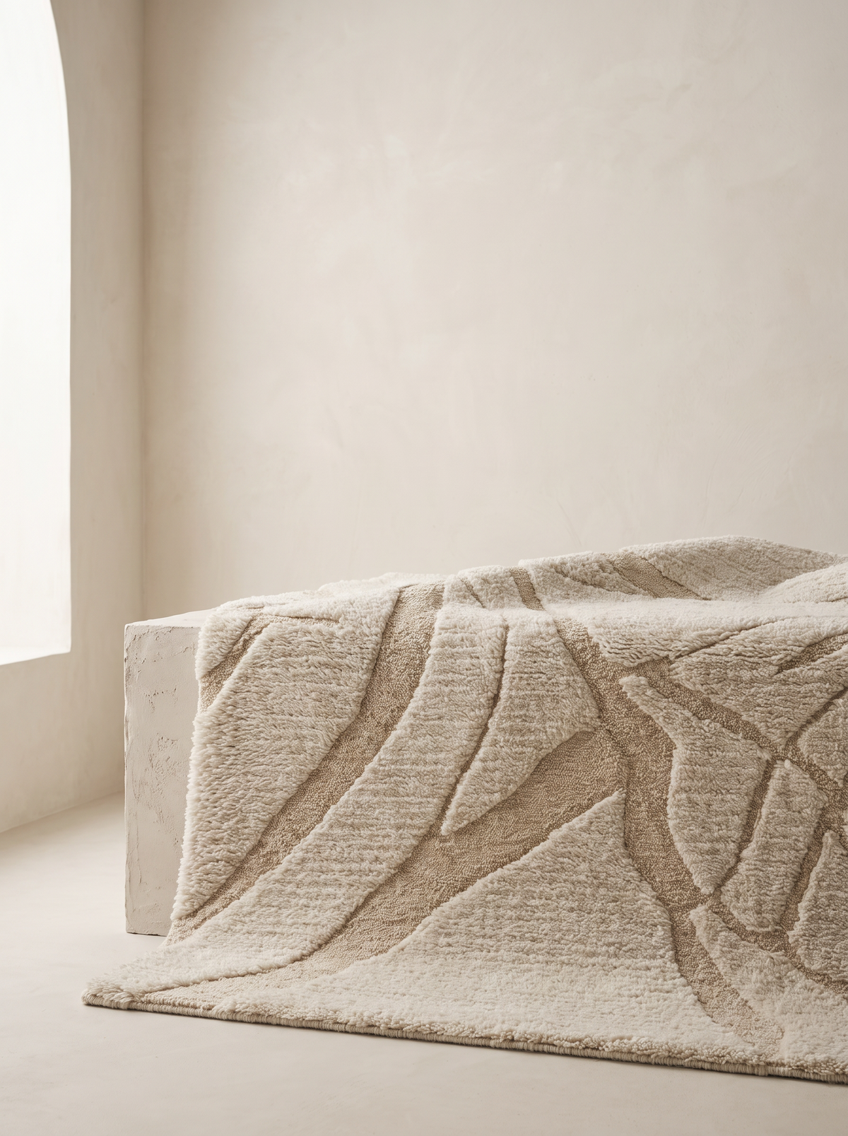 Contour rug draped over plaster plinth