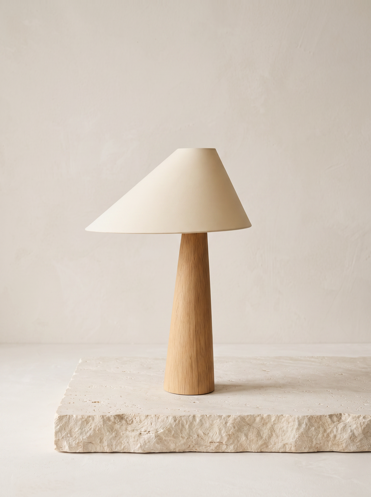 Mushi table lamp on pale limestone slab