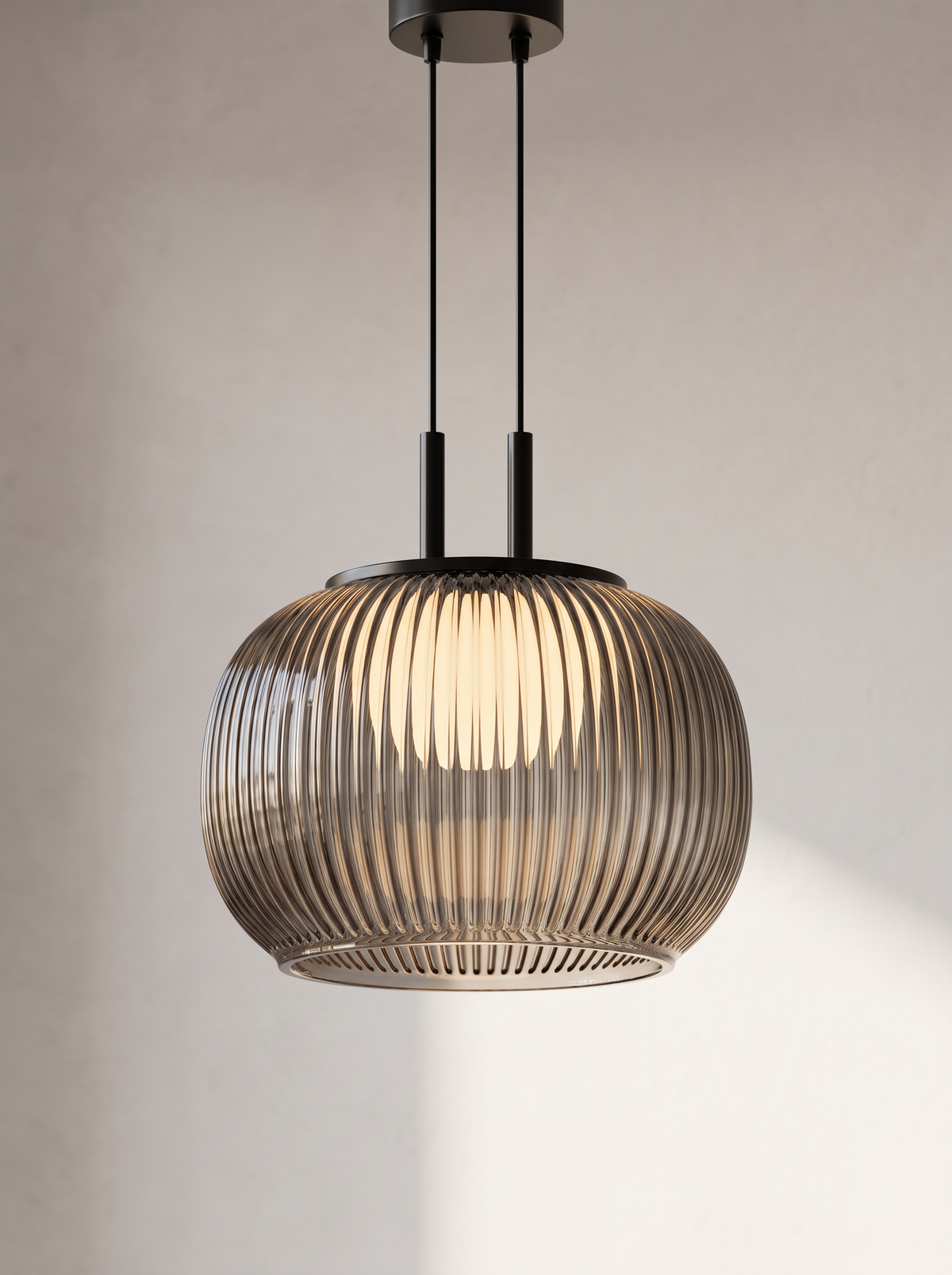 Close view of lit Filano ribbed glass pendant from below